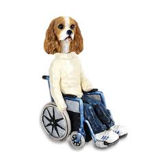 Breeders of merit are denoted by level in ascending order of: Cavalier King Charles Spaniel Brown White Wheelchair Doogie Collectable Figurine