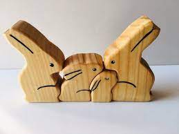 Each puzzle tells its own story with special characters and puzzle pieces. Bunny Rabbit Easter Wooden Puzzle Family Toy Made In Australia Etsy Waldorf Inspired Toys Waldorf Toys Wooden Puzzles