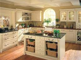 Cream colored cabinets with large black island. Cream Kitchen Cabinets Warm Colors For A Cozy Atmosphere Deavita