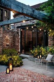 Courtyard Gardens Are Perfectly Matched With Garden Lanterns And Festoon Lights Pinterest Carriefiter 90s Fashion Stree Backyard Patio Courtyard Garden