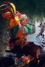 Before he adopted a more casual look, elton john had an affinity for jeweled jumpsuits, flamboyant feathered frocks and outrageous costumes. Rock It Man Elton John S Fashion Evolution Elton John Elton John Costume The Muppet Show