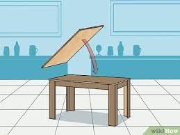 On a table (the standard size of a beer pong table is 2 feet wide x 8 feet long) set up ten cups on either end in the form of a pyramid. 3 Ways To Make A Beer Pong Table Wikihow
