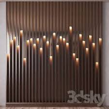 The grey upholstered headboard in this modern bedroom has angular panels with hidden lighting between them to give the bedroom a soft glow. 89 Light Walls Ideas In 2021 Wall Design Wall Cladding Wall Paneling
