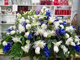 Flowers for cremation services are also available. Blue White Casket Spray In Monroe Nc Monroe Florist Gifts