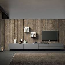 The dark faux wood border lends an imposing vibe to the room and the soft marble backdrop exudes elegance and grace. Tv Unit Composition Radical By Morassutti Features 3 Wooden Wall Mounted Units And A Wooden Bas Contemporary Tv Units Modern Tv Wall Units Wall Tv Unit Design
