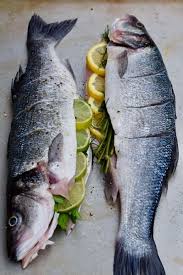 Line a baking sheet with parchment paper and spray it generously with nonstick cooking spray. Grilled Whole Fish Stuffed With Lemon And Herbs Grilled Fish Recipes Whole Fish Recipes Bbq Fish