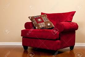 For a modern touch, opt for oversized chairs with arms that slightly flare out; A Modern Red Fabric Oversized Chair On Hardwood Flooring In A Stock Photo Picture And Royalty Free Image Image 5452075