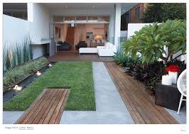Small Back Garden Design Plants Include Ornamental Ginger Mexican Lily Bangalore Palms Ce Modern Landscaping Modern Landscape Design Small Garden Landscape