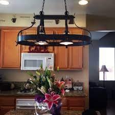 Use decorative ceiling fixtures supplemented by recessed lights for style and even light. Kitchen Light Fixture With Pot And Pan Holders Bought At Lowes Com Home Home Decor Kitchen Lighting