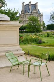 green chairs in paris with the musee du louvre paris with landen paris garden tuileries garden france aesthetic