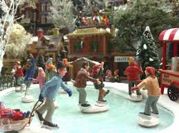 The trees above the ice rink were gorgeous covered in snow. Christmas Village Animated Skating Scenes Christmas Villages