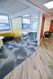 Radial And Level Set Woodgrains Used At Huddersfield University To Define Clear Working Zones Radial Luxury Vinyl Tile Biofilic Design Office Interior Design