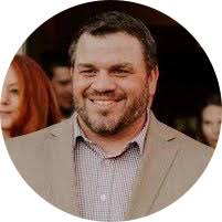 Who started/1st coach the wrestling program.