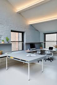 Grt Architects Creates New York Office With Millennial Pink Kitchen Architect Office Workspace Office Interiors Sloped Ceiling Lighting