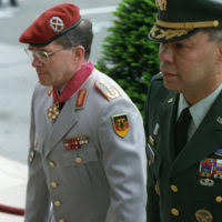 U.S. Army GEN. Colin Powell (right), Chairman of the Joint Chiefs of STAFF,  escorts GEN. Klaus Naumann, German Inspector General of the Bundeswehr  (Unified Armed Forces of Germany), through an Honor Cordon