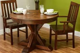 A table has a square top, covered with a clear glass tile, and straight angular legs. Cherry Wood Dining Room Furniture Countryside