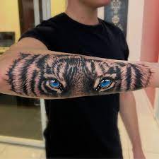 Updated 38 Fierce Tiger Eyes Tattoo Designs July 2020 Tiger Eyes Tattoo Tiger Forearm Tattoo Tattoos