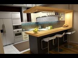 A clean white countertop and glossy brown cabinetry, paired with simple brown backed barstools give a modern feel to this kitchen. Some Basic Designs And Ideas Of Peninsula Kitchen Layout Youtube