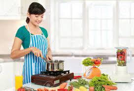 If you're looking to boost your small kitchen's functionality and fun without tearing it down to the studs, these useful design ideas can transform the space. Beautiful Woman Cooking Something In The Kitchen Stock Photo Picture And Royalty Free Image Image 12371463