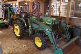 Gauge wheel tires are worn. John Deere 2x4 Diesel 750 Jd750 2wd Two Wheel Drive Tractor With Model 7 Backhoe 67 Front Loader 603 Rotory Mower Brush Hog
