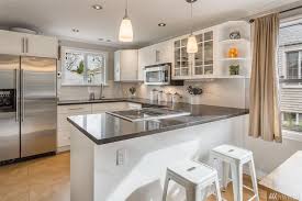 Contemporary Kitchen With Flush Light Limestone Tile Floors Flush L Shaped Kitchen Peninsula Contemporary Kitchen Kitchen Remodel Small Flat Panel Cabinets