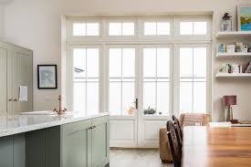 Signatures Traditional French Doors With Fixed Sightlines Make The Room Feel Homely Traditional And Cosy Traditional French Doors French Doors Wooden Windows