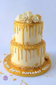 2 Tier White Chocolate With Gold Drip Scandalous Karen S Cakes Golden Birthday Cakes Cake Butterscotch Cake