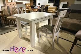 Whether you're dining with family or friends, a beautiful extending dining table and chairs is perfect for when you need a bit of extra space. Set Of White Extending Dining Table And 4 Wooden Chairs With Beige Fabric Alla2