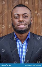 Afro American Man in Suit Smiling and Looking at Camera