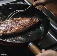 Download Premium Photo Of Chef Cooking Steak In A Pan Food Photography
