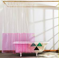 Brushed nickel shower head with digital shower valve, victoria and albert bathtub, curbless shower with hidden shower drain, flat pebble shower floor, shelf over tub with led lighting, gray vanity with drawer fronts, white square. 10 Cute Trendy Shower Curtains Best Shower Curtains