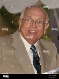 Honorary Mayor of Hollywood Johnny Grant, left, stands alongside actress  Salma Hayek, Major General Peter Gravett, Commanding General , 40th  Division, of the California National Guard and actor Garrett Morris stand  infront