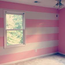 The deep pink wall gives a girly look to this sunny bedroom for a baby girl. Pink And White Horizontal Wall Stripes Nursery Babygirl Striped Walls Pink Striped Walls Teal Bedroom Walls