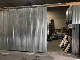 Steel garage doors have the largest variety of sizes, colors, styles, window options, and finishes. Barn Door Style Sliding Corrugated Metal Door Rack And Stack Pallet Racking Display And Material Handling K Bid