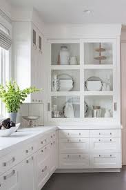 Add draw inserts, pulls, and slides to take your storage up a notch. White Drawers Donning Satin Nickel Pulls And A White Quartz Countertop Are Fi Kitchen Cabinets Design Layout Glass Kitchen Cabinet Doors Kitchen Cabinet Design