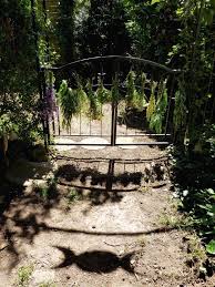 Gorgeous Herbs And Witch S Garden Gate With Triple Moon Witch Garden Moon Garden Witchy Garden