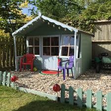 Beautiful children's playhouses with a covered front porch. Shire Pixie Wooden Playhouse Elbec Garden Buildings