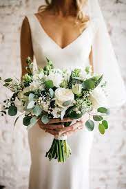 Opt for simple green leaves and vines for a woodsy, rustic look. 20 Elegant White And Greenery Wedding Bouquets Bouquets Elegant Greenery Wedding White Blumenstrauss Hochzeit Hochzeit Blumenarrangements Hochzeit Strauss