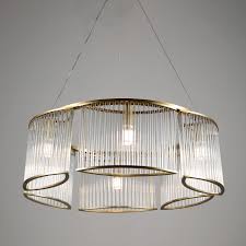 Crafted from metal, it features a circular ceiling mount, a hanging chain, and six lights sticking out from rods at all angles for a modern and linear look. 240 Glasses Chandelier 6 Light Brass Jimmyraiden Llc