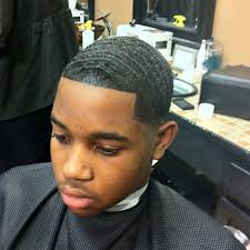 Young african american woman cutting her frizzy afro hair with s. African American Boy Hair Cuts Novocom Top