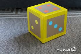 Once all of the flaps have two cuts half up, slide the cuts onto each other to form a grid (it will look like the spacers inside a case of wine). Easy Diy Giant Dice The Craft Train
