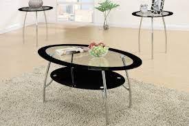 Coffee tables serve so many purposes: 3 Piece Coffee Table Set With Black Glass And Metal Legging