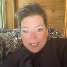 Who is a good hair stylist in Ludington for growing out bangs and gray hair?