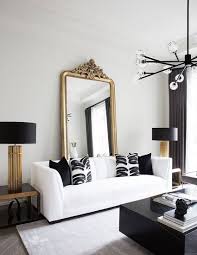 Absolute Glam Gold Black And White Glam Condo Apartment Featuring A White Leather Sofa And A Gold Living Room Black And White Living Room Living Room Designs