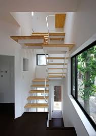 House At Matsubara By Atelier Hako Architects Is Lined With Gingko Trees Small Space Architecture Space Architecture Interior Stair Railing