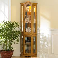 Cabinet curio lights bearhollowsupply 5 out of 5 stars (799) $ 12.50. Southern Enterprises Dahley Golden Oak Lighted Corner Curio Cabinet Walmart Com Walmart Com