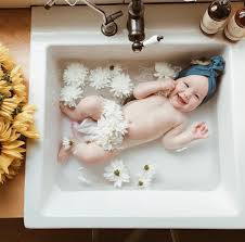 Mother bathing her baby and her son watching it. 110 Baby Bath Photoshoot Baby Bath Photography Ideas In 2021 Bath Photography Baby Bath Baby Photography