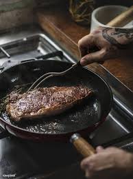 Download Premium Image Of A Chef Cooking Steak In A Pan Food Photography How To Cook Steak Food Cooking