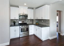 Mediacarrot Photography Grey Countertops Grey Kitchen Walls Warm Wood Flooring