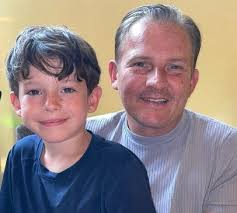 Brain injury survivor recognised for prestigious award after 20 years of  service